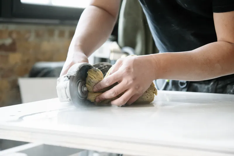 Hand-finishing the stone worktop