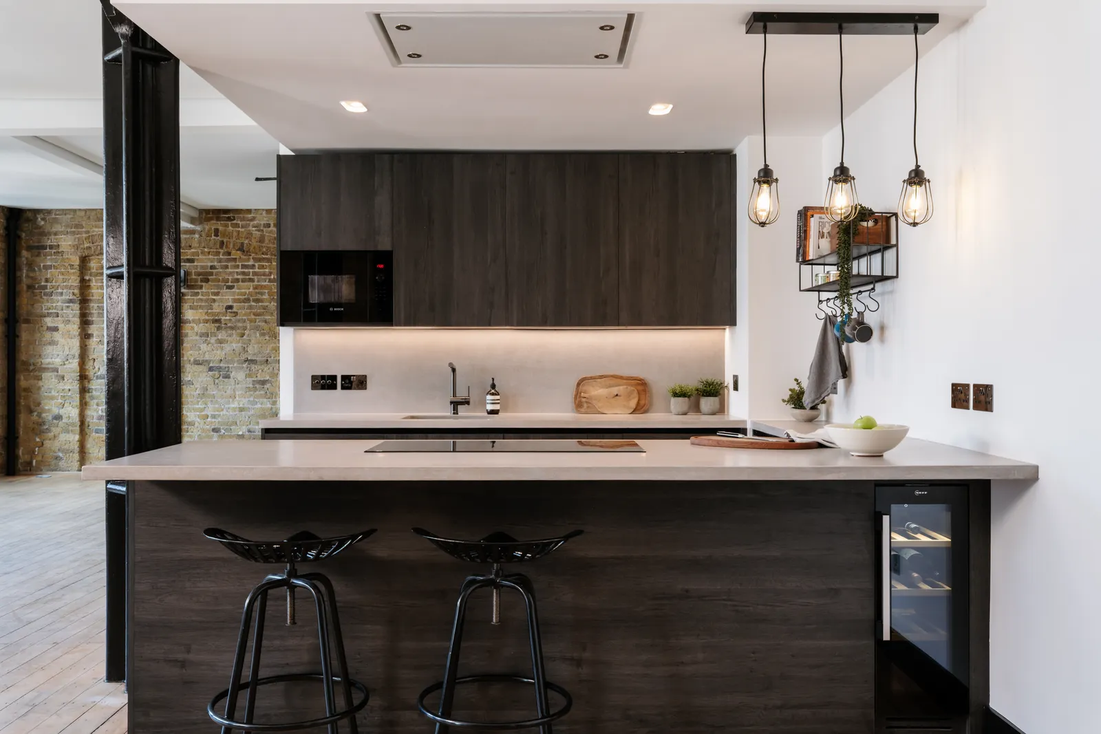 Bespoke kitchen within an existing brick and steel structure