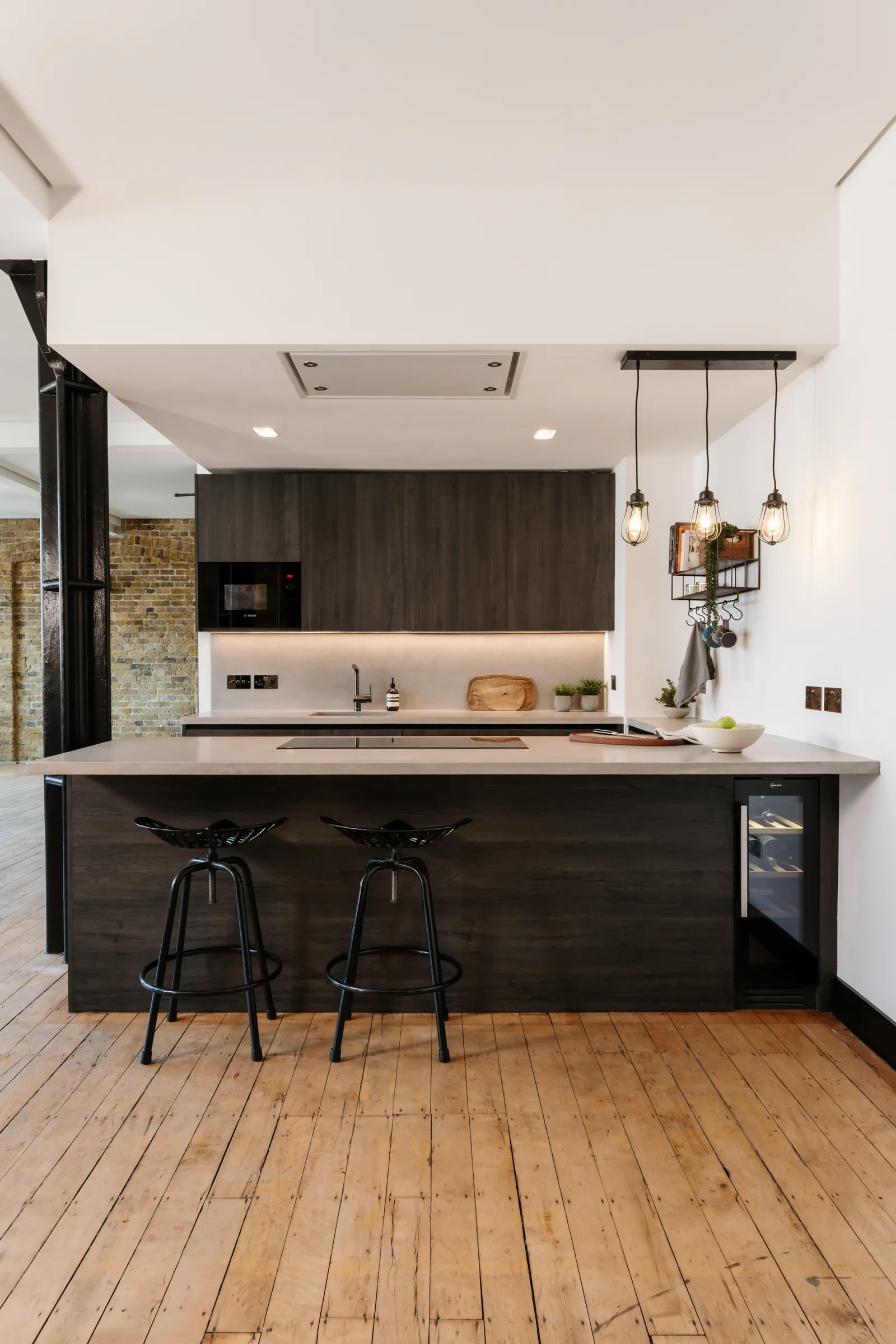Bespoke black kitchen in a warehouse conversion by Alico Engineering, City of London